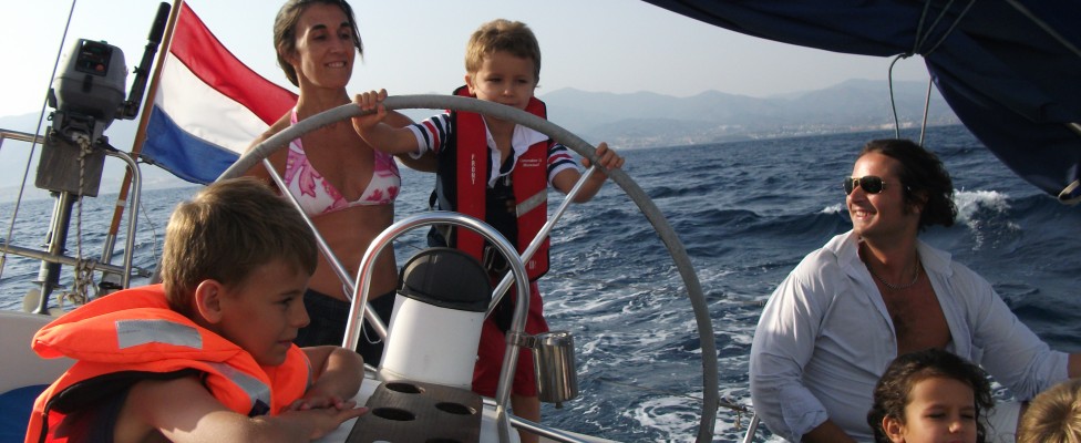 kids steering the boat